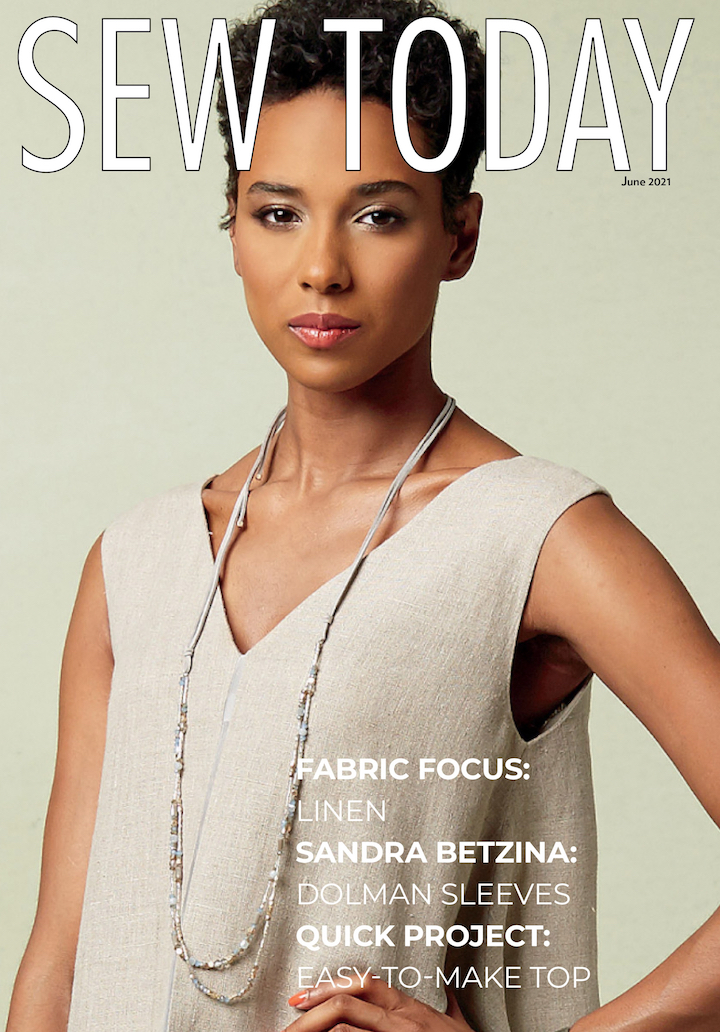 Cover of Sew Today magazine, June 2021: model in Paco Peralta tunic pattern Vogue 1550 in linen with silk contrast. Text reads: FABRIC FOCUS: LINEN - SANDRA BETZINA: DOLMAN SLEEVES - QUICK PROJECT: EASY-TO-MAKE TOP
