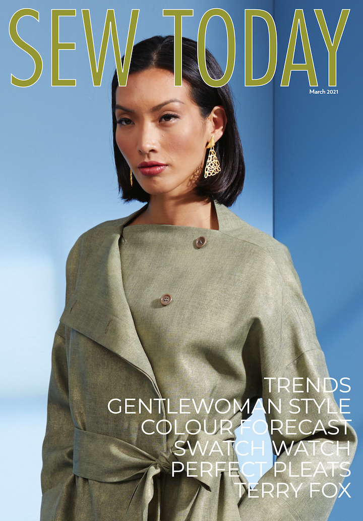 Cover of Sew Today magazine, March 2021: model Piyawan Chitsamran in Paco Peralta coat pattern Vogue 1619 in waxed polyester. Text reads: TRENDS - GENTLEWOMAN STYLE - COLOUR FORECAST - SWATCH WATCH - PERFECT PLEATS - TERRY FOX